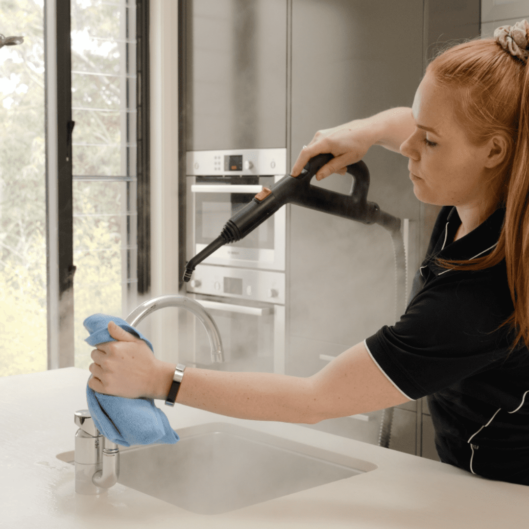 steam sanitising tapware in kitchen