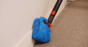 Skirting board cleaning and carpet sanitising with dry steam cleaner